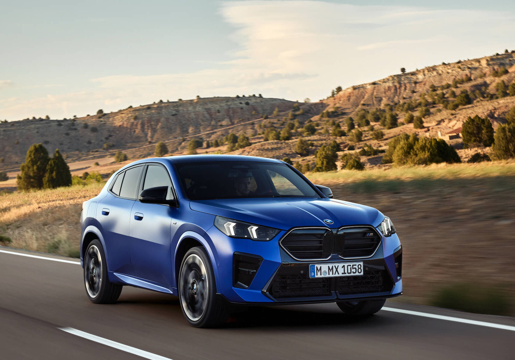 2024 BMW X2 Blue 2024 BMW X2 driving on road