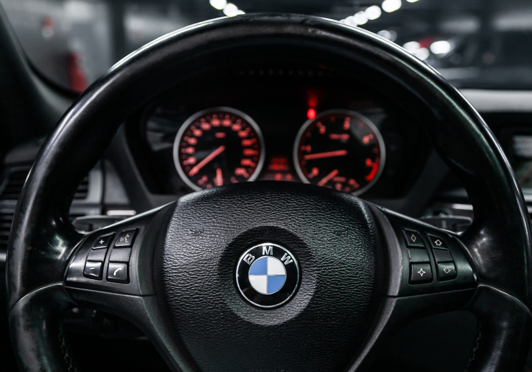 Novosibirsk, Russia  July 08, 2019:  BMW X5, close-up of the dashboard, speedometer, tachometer and steering wheel. . modern car interior