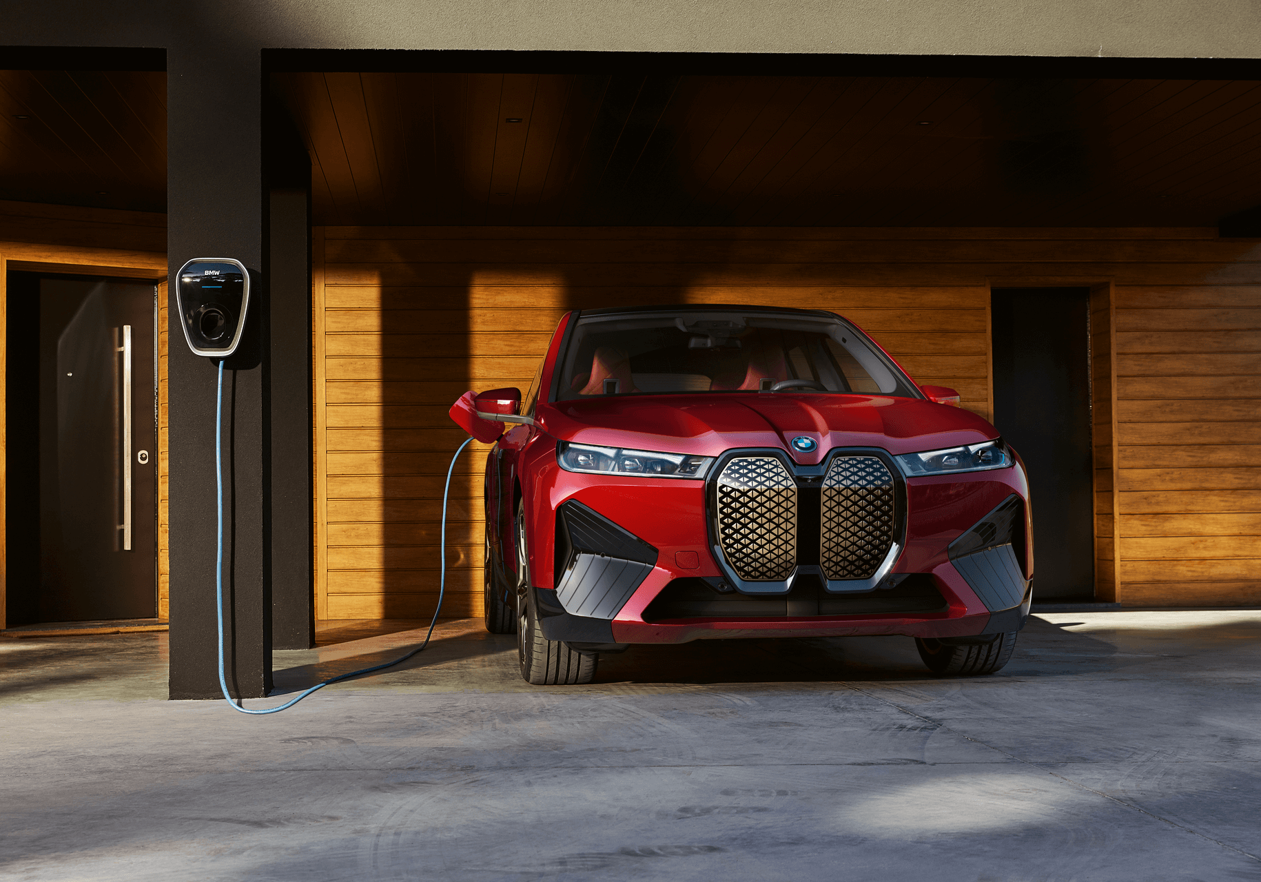 Red BMW iX Charging